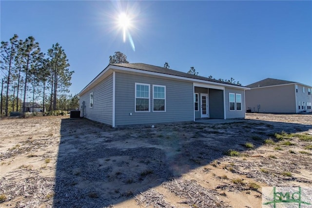 view of front of home featuring french doors and cooling unit