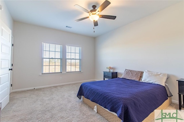 carpeted bedroom with ceiling fan, visible vents, and baseboards