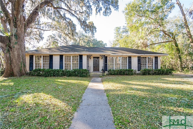 ranch-style home with a front yard