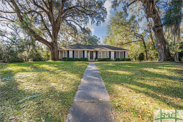 ranch-style house with a front lawn