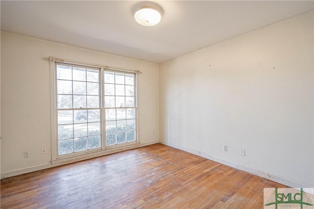 unfurnished room featuring light hardwood / wood-style floors