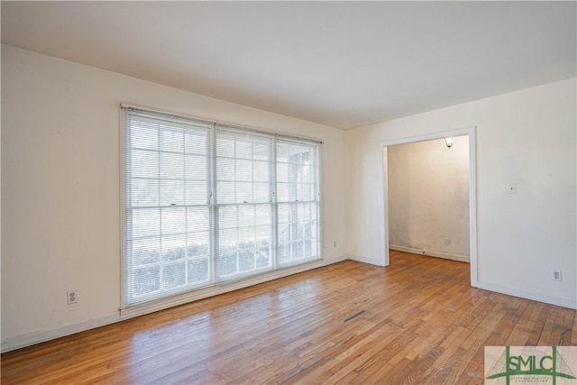 unfurnished room featuring light wood-type flooring