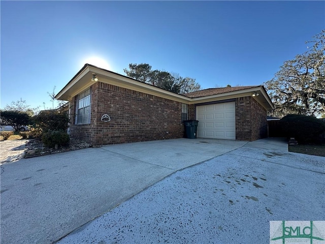 view of side of home featuring a garage