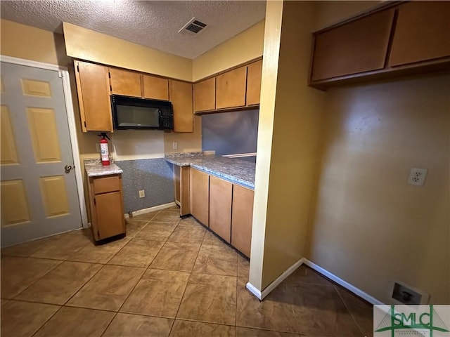 kitchen featuring a textured ceiling