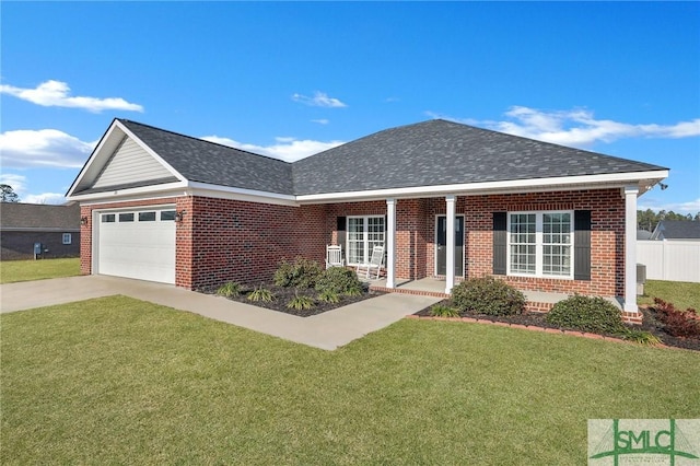 single story home with a porch, a garage, and a front lawn