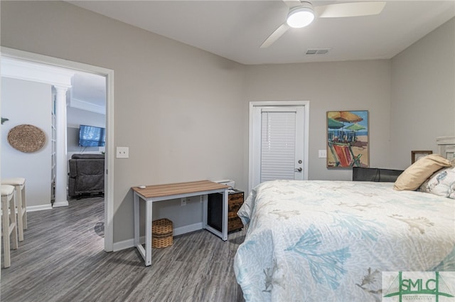 bedroom featuring dark hardwood / wood-style floors and ceiling fan