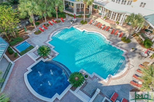 view of swimming pool with a patio