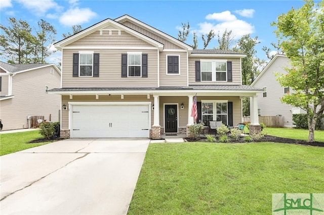 craftsman-style home featuring covered porch, a garage, and a front lawn