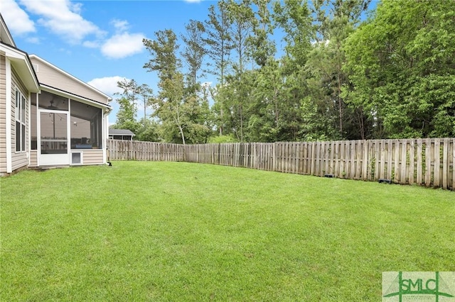 view of yard with a sunroom