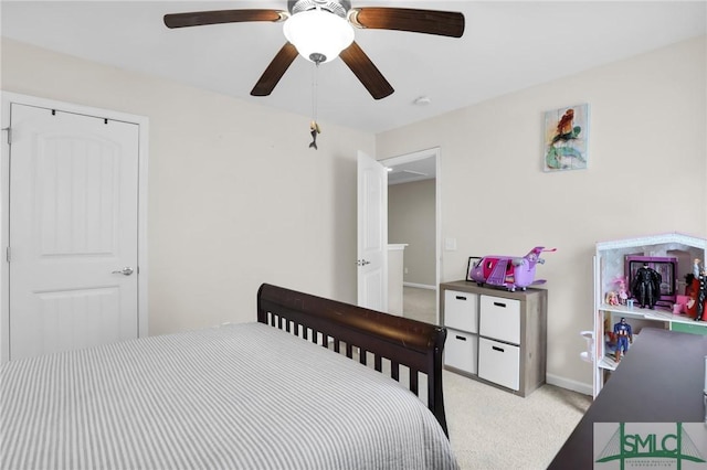 carpeted bedroom with ceiling fan