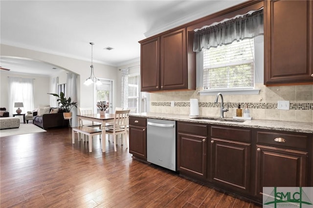 kitchen featuring pendant lighting, dishwasher, crown molding, sink, and dark hardwood / wood-style flooring