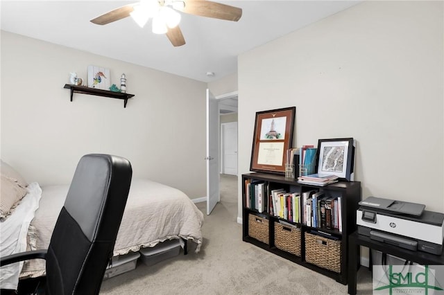 bedroom featuring ceiling fan and light colored carpet