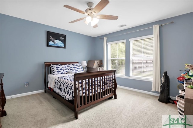 carpeted bedroom with ceiling fan