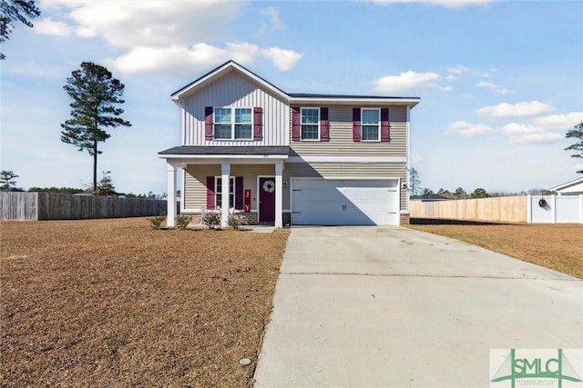 view of front of house with covered porch and a garage