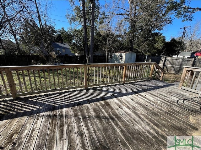 wooden terrace with a shed