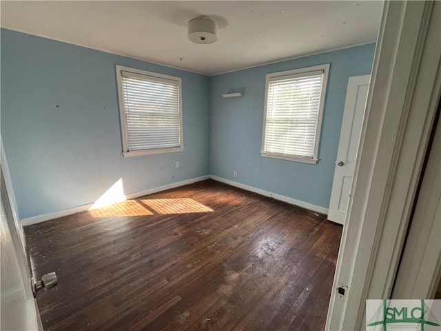 spare room featuring dark hardwood / wood-style floors