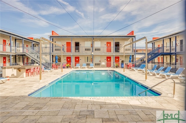 16 Tybrisa St Unit 127, Tybee Island, GA 31328 - community pool with a patio area and stairs