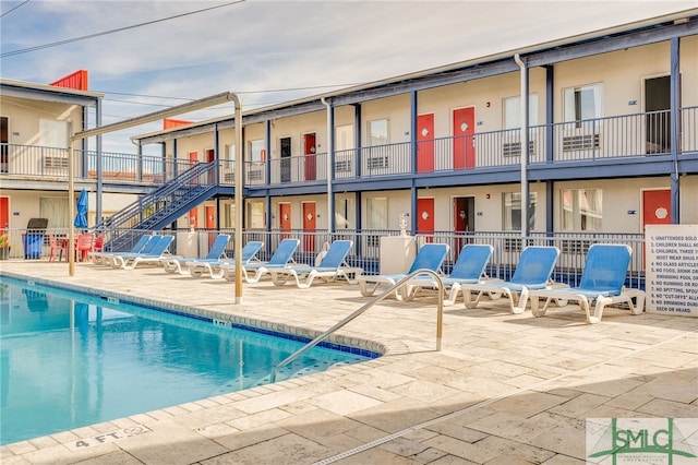 16 Tybrisa St Unit 127, Tybee Island, GA 31328 - community pool with a patio and stairway