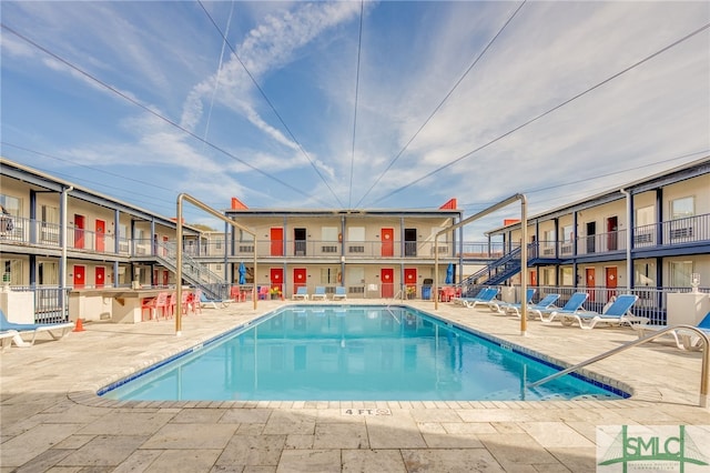 view of pool featuring a patio area