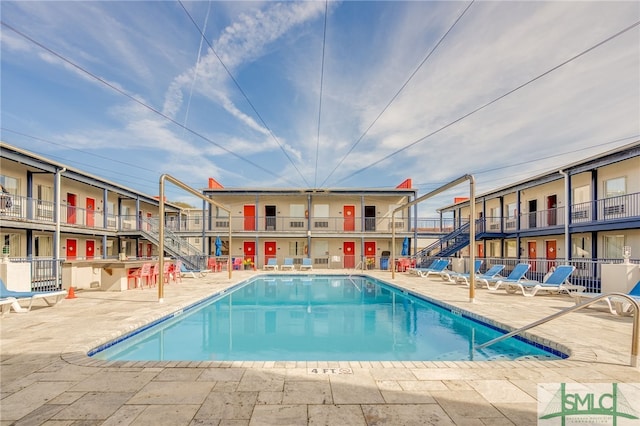 16 Tybrisa St Unit 127, Tybee Island, GA 31328 - community pool with a patio area and stairway