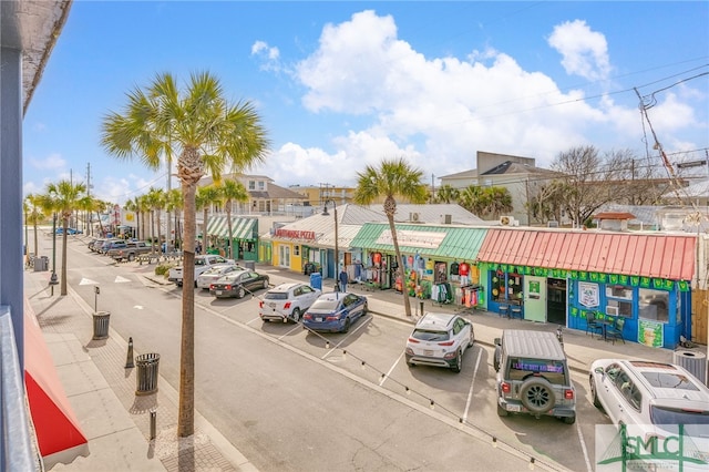 16 Tybrisa St Unit 127, Tybee Island, GA 31328 - view of asphalt road featuring sidewalks, street lighting, and curbs