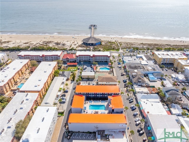 bird's eye view with a water view and a view of the beach