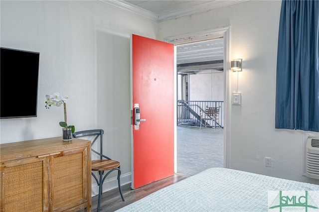 16 Tybrisa St Unit 127, Tybee Island, GA 31328 - bedroom with ornamental molding and wood finished floors