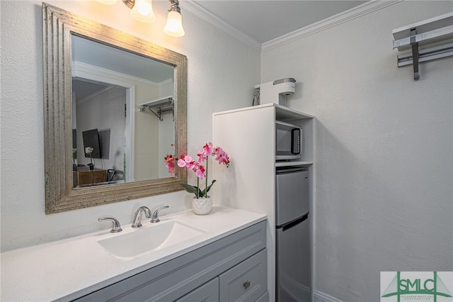 16 Tybrisa St Unit 127, Tybee Island, GA 31328 - bathroom featuring crown molding and vanity