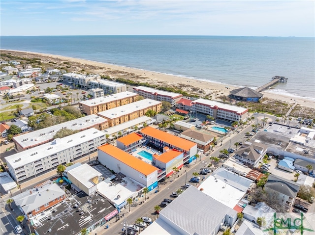 birds eye view of property featuring a view of the beach and a water view