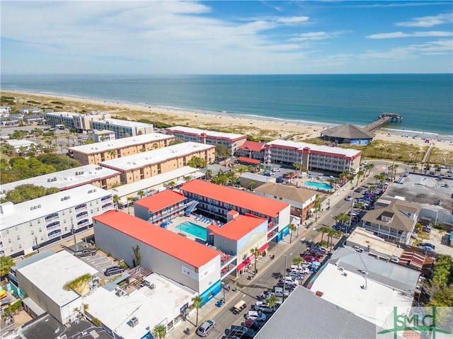 birds eye view of property featuring a view of the beach and a water view