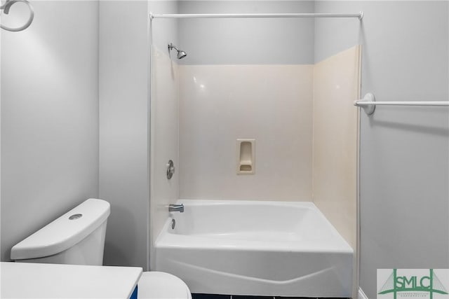 bathroom featuring toilet and shower / bath combination