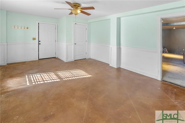 unfurnished room with ceiling fan