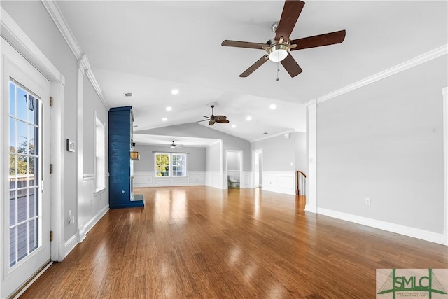 unfurnished living room with ornamental molding, vaulted ceiling, and hardwood / wood-style flooring