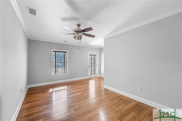 unfurnished room featuring ceiling fan, crown molding, and hardwood / wood-style floors