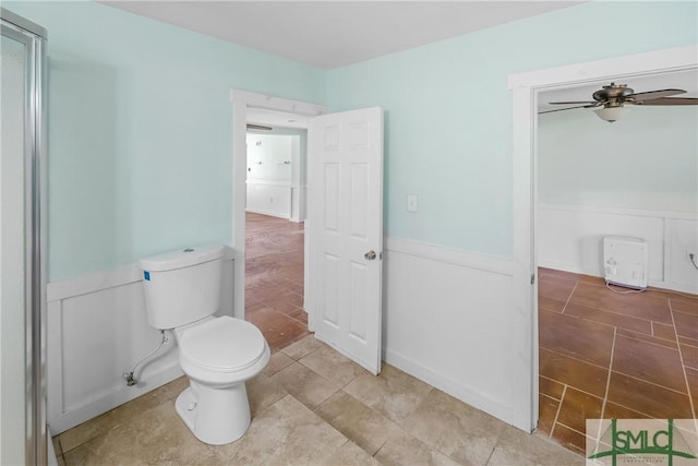 bathroom with toilet and ceiling fan