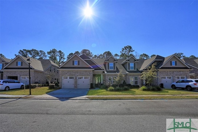 craftsman-style home with a front yard and a garage