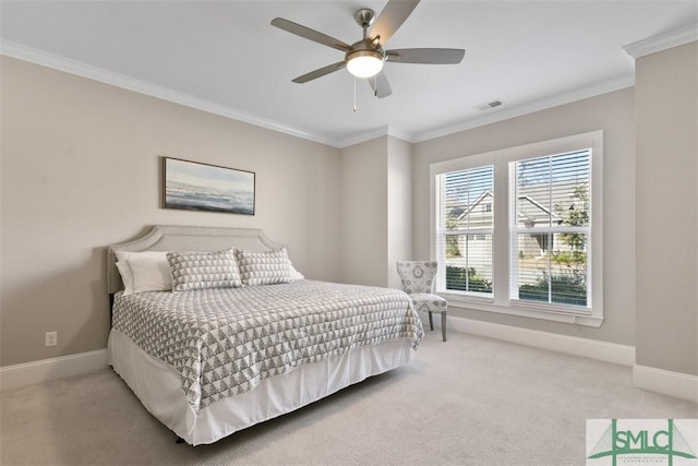 carpeted bedroom featuring ceiling fan and ornamental molding