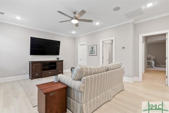 living room featuring ceiling fan, crown molding, and light hardwood / wood-style flooring