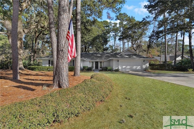 ranch-style home featuring a garage and a front yard