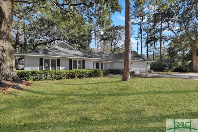 ranch-style house with a garage and a front lawn