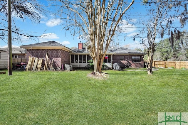 view of yard with cooling unit and a sunroom