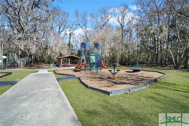 view of playground with a lawn