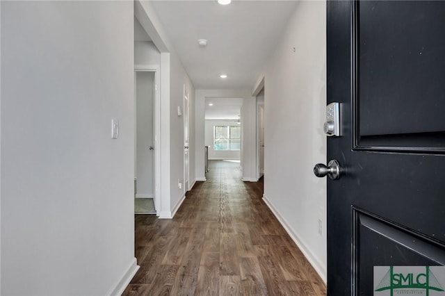 hallway featuring dark hardwood / wood-style floors