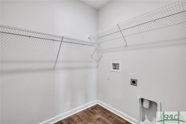 laundry room with washer hookup, dark wood-type flooring, and electric dryer hookup