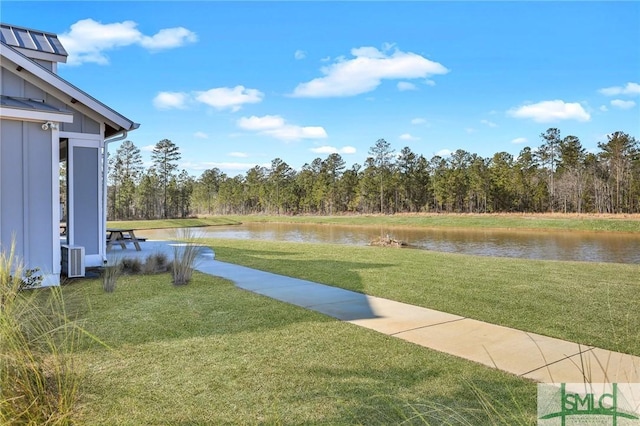 view of yard with a water view and cooling unit