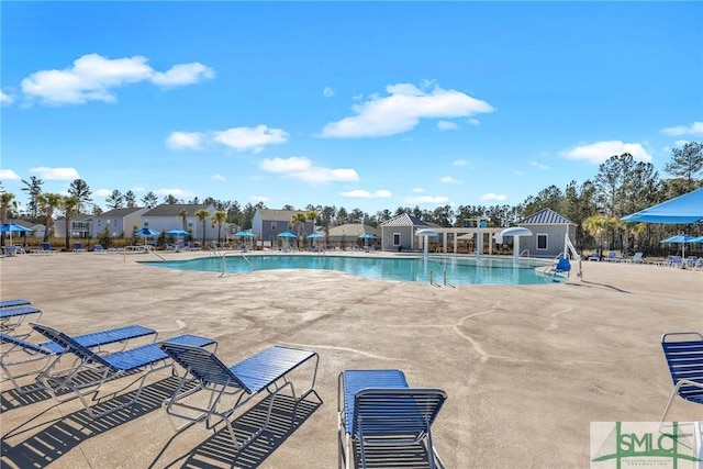 view of swimming pool with a patio area