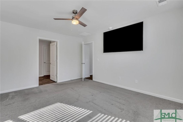 unfurnished bedroom featuring carpet and ceiling fan