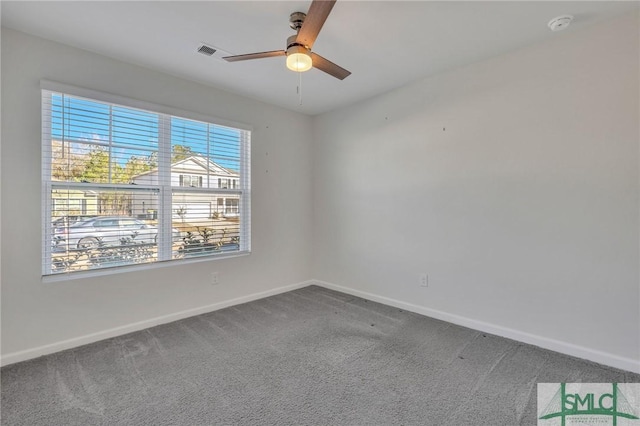 empty room featuring carpet and ceiling fan