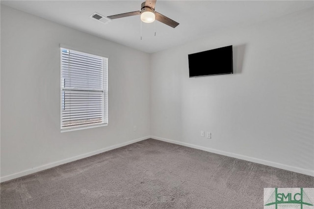 unfurnished room featuring ceiling fan and carpet floors