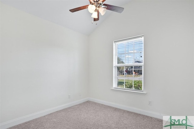 carpeted empty room featuring ceiling fan and lofted ceiling